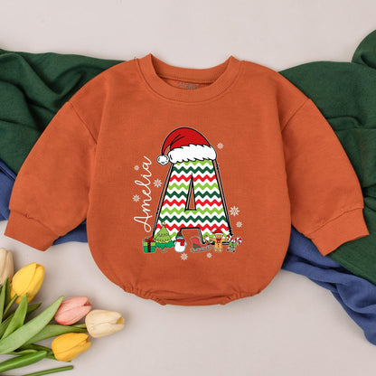 Personalized Name Baby Girl Christmas Bubble Romper featuring a cute Santa hat, zigzag 'A' and fun festive winter characters perfect for a holiday newborn gift