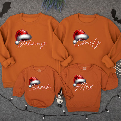 Personalized Christmas Family Sweatshirt with Santa Hat Name Design Festive Holiday Matching Xmas Outfits for Mom Dad Kids Playful Celebration Gear