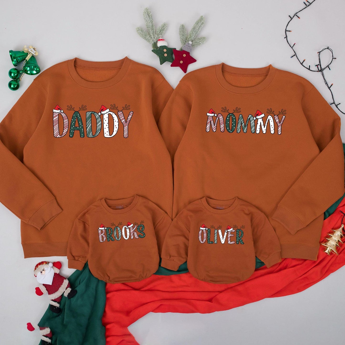 Personalized Christmas Family Sweatshirts Daddy Mommy Custom Names with Reindeer Antlers and Santa Hats Festive Holiday Outfits for Mom Dad and Kids
