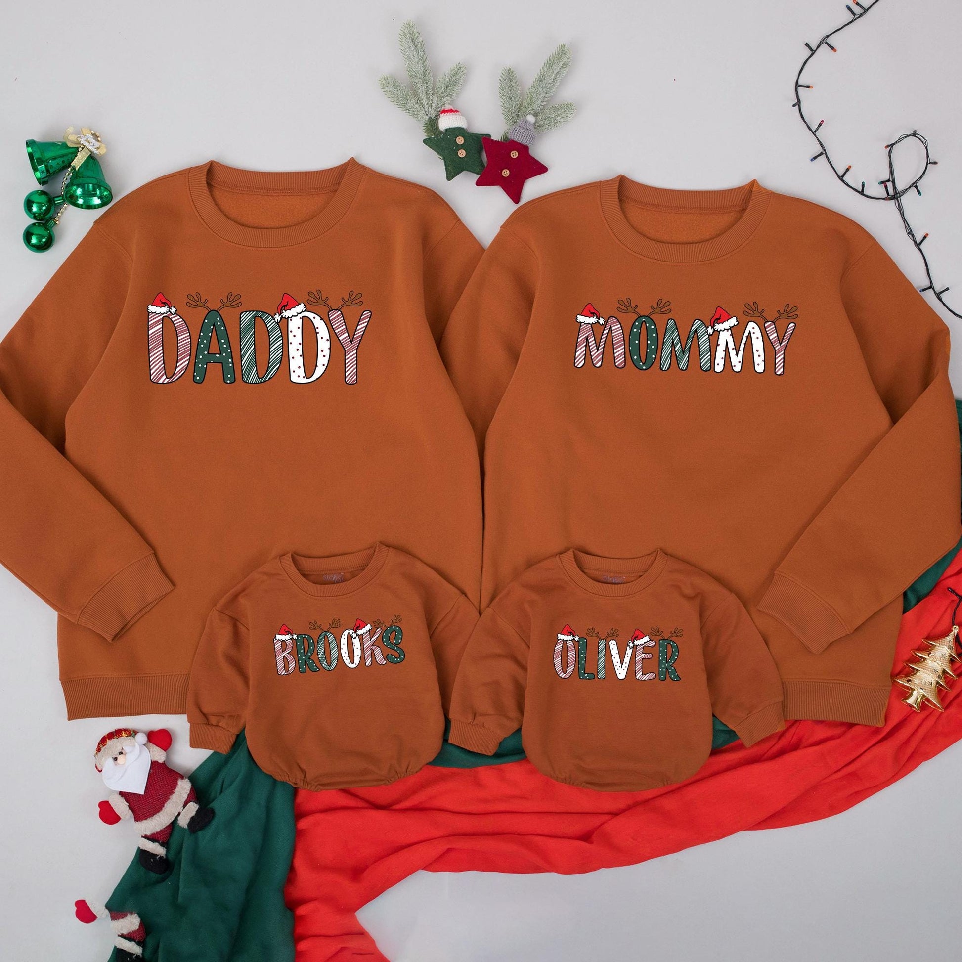 Personalized Christmas Family Sweatshirts Daddy Mommy Custom Names with Reindeer Antlers and Santa Hats Festive Holiday Outfits for Mom Dad and Kids