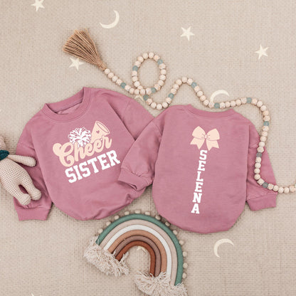 Custom Cheer Sister Romper: Name & Number Personalized Cheerleading Outfit, Cute Game Day Baby Romper Football Design, Adorable Gift, Soft Cotton, 135 chars
