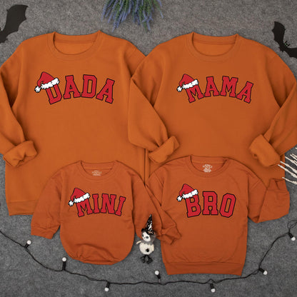 Festive Matching Family Christmas Sweatshirts featuring Dada Mama Mini Bro Santa Hat Designs Holiday Pajama Tops for Kids Baby Adults Cozy