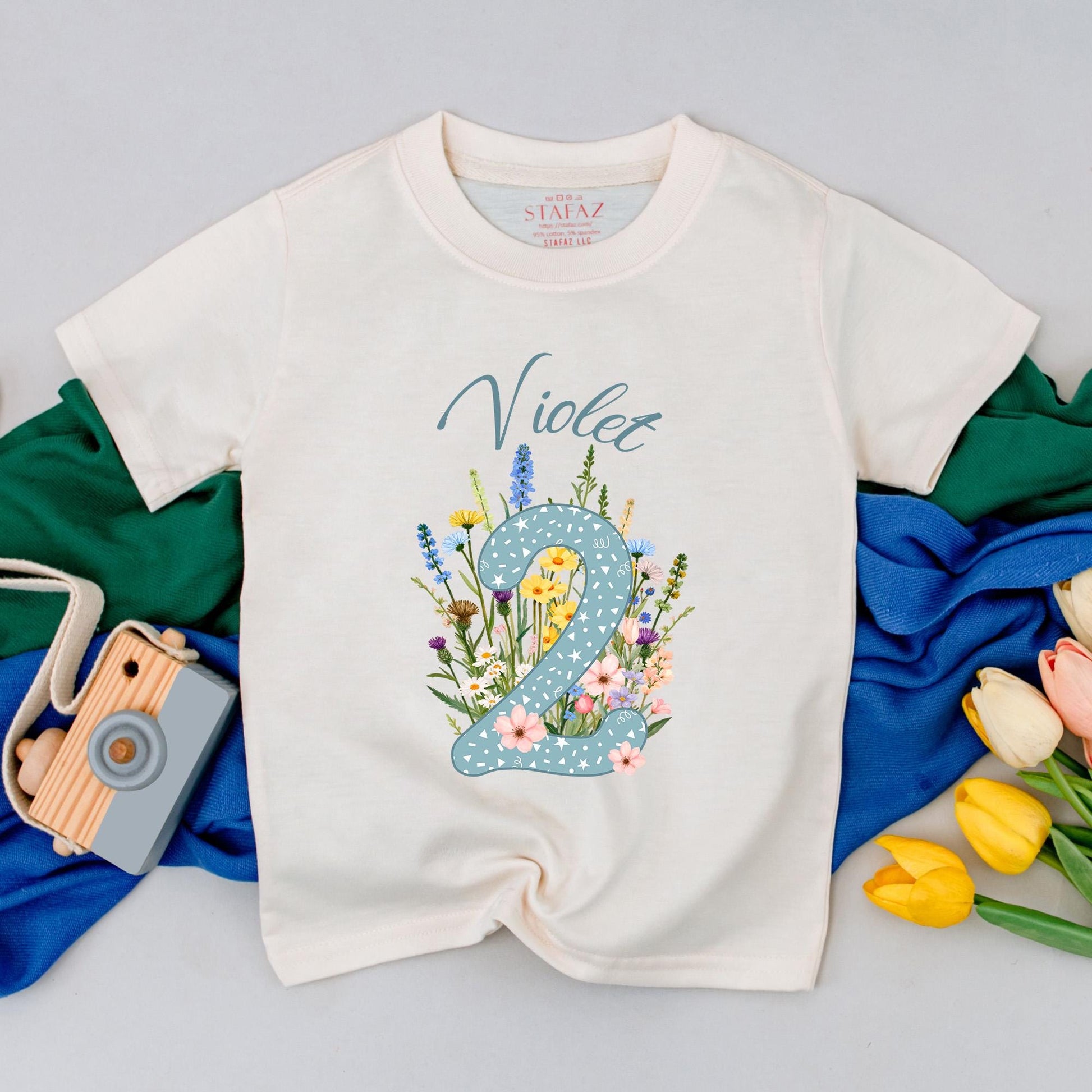 Personalized Violet Wildflower Two Birthday T-Shirt for Girls, Floral 2nd Birthday Party Toddler Outfit with Starry Blue Number 2 and Whimsical Blooms Cotton Comfortable Gift Idea