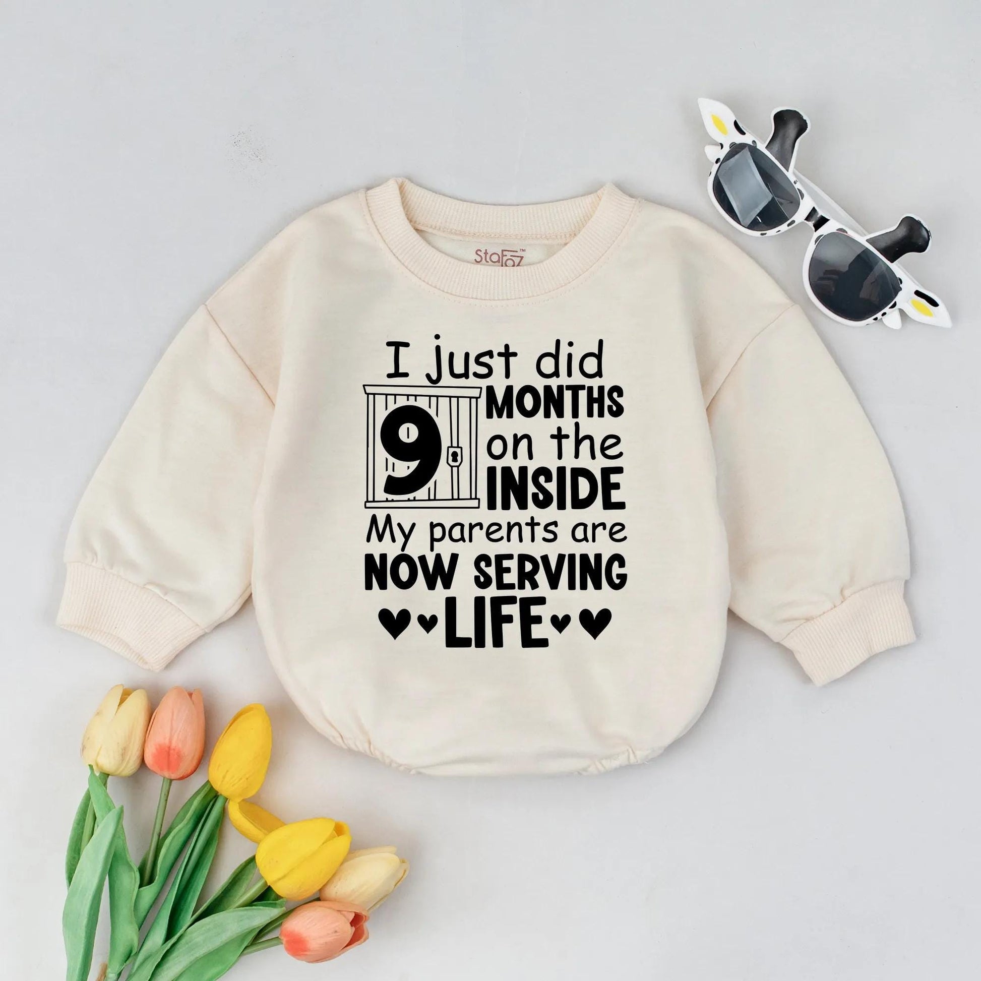 Funny Newborn Baby '9 Months On The Inside' Romper with Jail Bar Design Padlock Detail & 'Parents Serving Life' Text. Perfect Coming Home Outfit or Baby Announcement Gift Bodysuit.