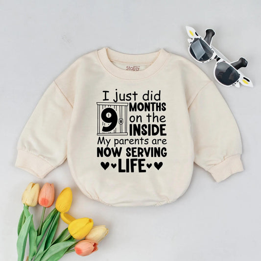 Funny Newborn Baby '9 Months On The Inside' Romper with Jail Bar Design Padlock Detail & 'Parents Serving Life' Text. Perfect Coming Home Outfit or Baby Announcement Gift Bodysuit.