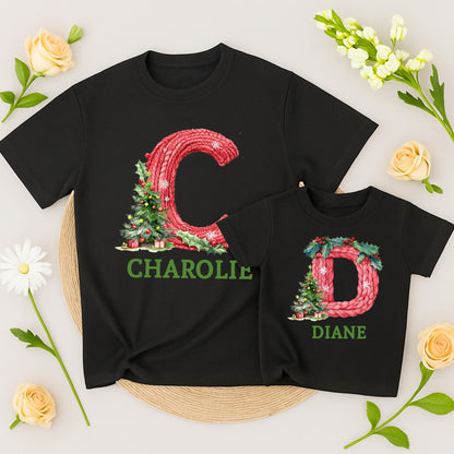 Personalized Family Christmas Shirt Initial & Name Festive Holiday Tee Knitted Red Letter Snowflakes Holly Berries Tree Gift Boxes Green Text