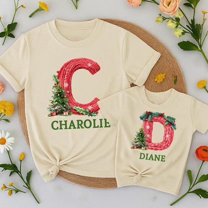 Personalized Family Christmas Shirt Initial & Name Festive Holiday Tee Knitted Red Letter Snowflakes Holly Berries Tree Gift Boxes Green Text