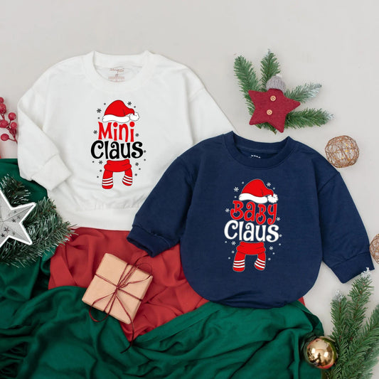 Custom Claus Family Sweatshirts Matching Christmas Holiday Outfits with Red Santa Hats and Snowflakes Perfect for Xmas Parties and Family Reunions